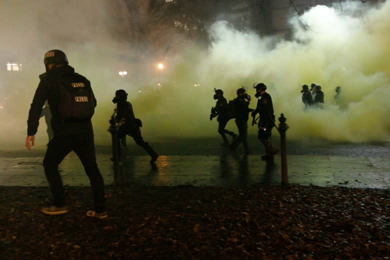 Protesters clash with police officers during a protest against police brutality near the Federal Courthouse in Portland, Oregon, in December 2020. (John Rudoff/Anadolu Agency via Getty Images)