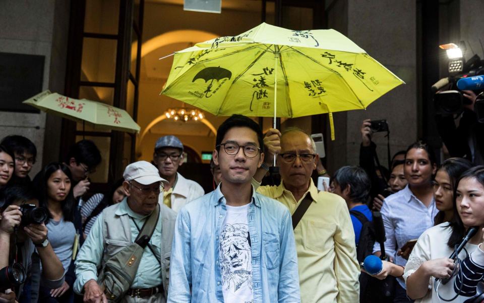 Nathan Law, one of Hong Kong's most prominent young democracy activists, has announced that he has fled to London - Isaac Lawrence/AFP via Getty Images