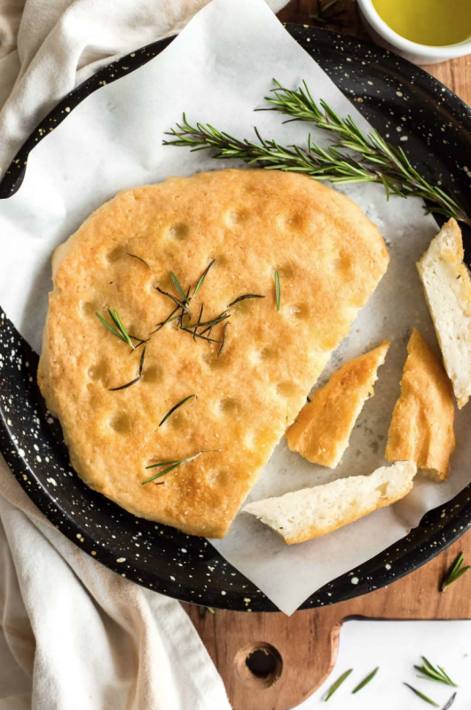 <p>Dish by Dish</p><p>Crispy on the outside, fluffy on the inside, this beautiful no-knead rosemary focaccia bread is super easy to make and deliciously addictive. Perfect for serving alongside this extra virgin olive oil! Gluten-free and vegan too.</p><p><strong>Get the recipe: <a href="https://www.dishbydish.net/rosemary-focaccia-bread-gluten-free-vegan/" rel="nofollow noopener" target="_blank" data-ylk="slk:Rosemary Focaccia Bread (Gluten-Free, Vegan);elm:context_link;itc:0;sec:content-canvas" class="link ">Rosemary Focaccia Bread (Gluten-Free, Vegan)</a></strong></p>