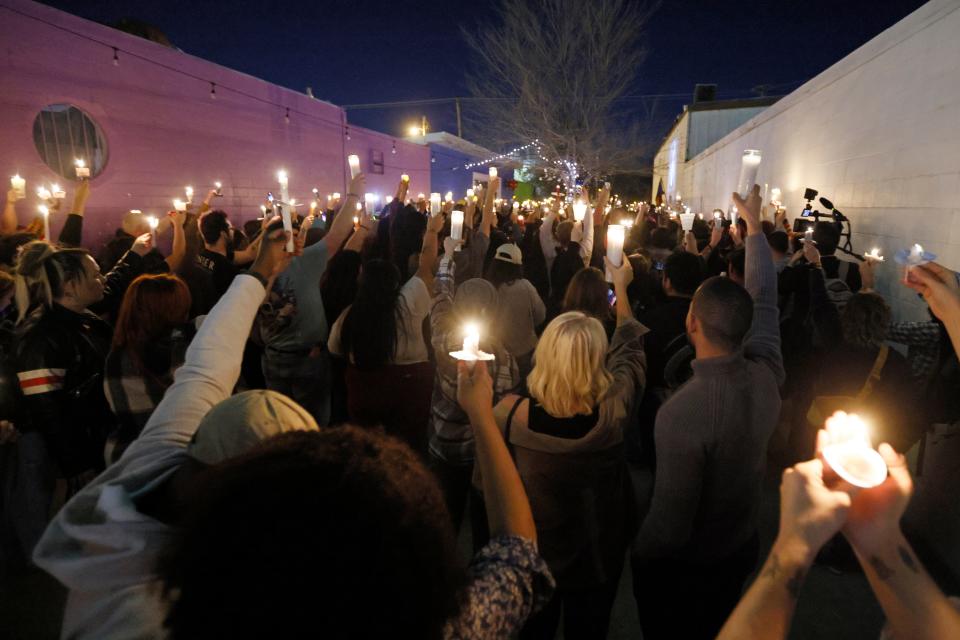 Hundreds of people hold up candles during a candlelight service for Nex Benedict on Saturday at Point A Gallery, 2124 NW 39 Street in Oklahoma City. (Credit: NATE BILLINGS/FOR THE OKLAHOMAN)