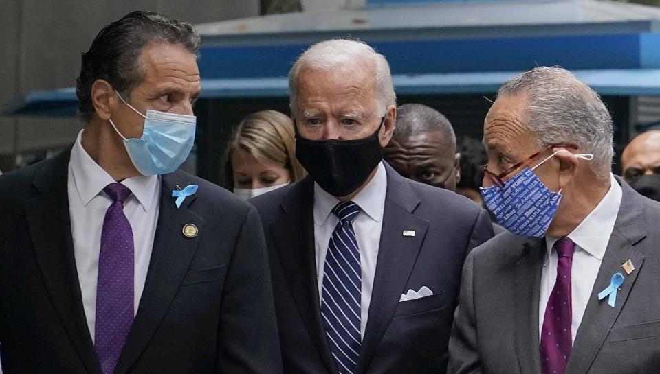 FILE - This photo from Friday, Sept. 11, 2020, shows President Joe Biden, center, as a presidential candidate walking with New York Gov. Andrew Cuomo, left, and Sen. Chuck Schumer of N.Y., after arriving for a ceremony marking the 19th anniversary of the Sept. 11 terrorist attacks. Senate Majority Leader Schumer declined to comment on Cuomo's crisis on Friday, as he stood alongside Biden in a Rose Garden ceremony celebrating the passage of the Democrat-backed $1.9 trillion pandemic relief bill. (AP Photo/Patrick Semansky, File)