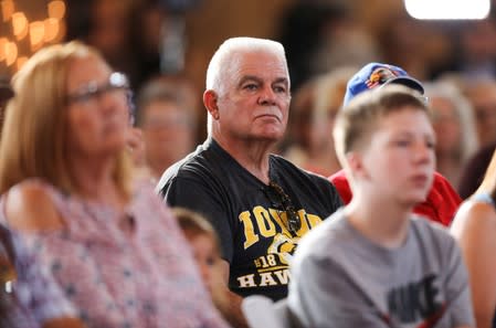 Voters listen as 2020 Democratic U.S. presidential candidate and former Vice President Joe Biden speaks during a campaign stop in Burlington