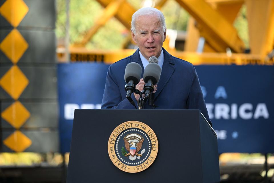 President Biden at a podium with the presidential seal.
