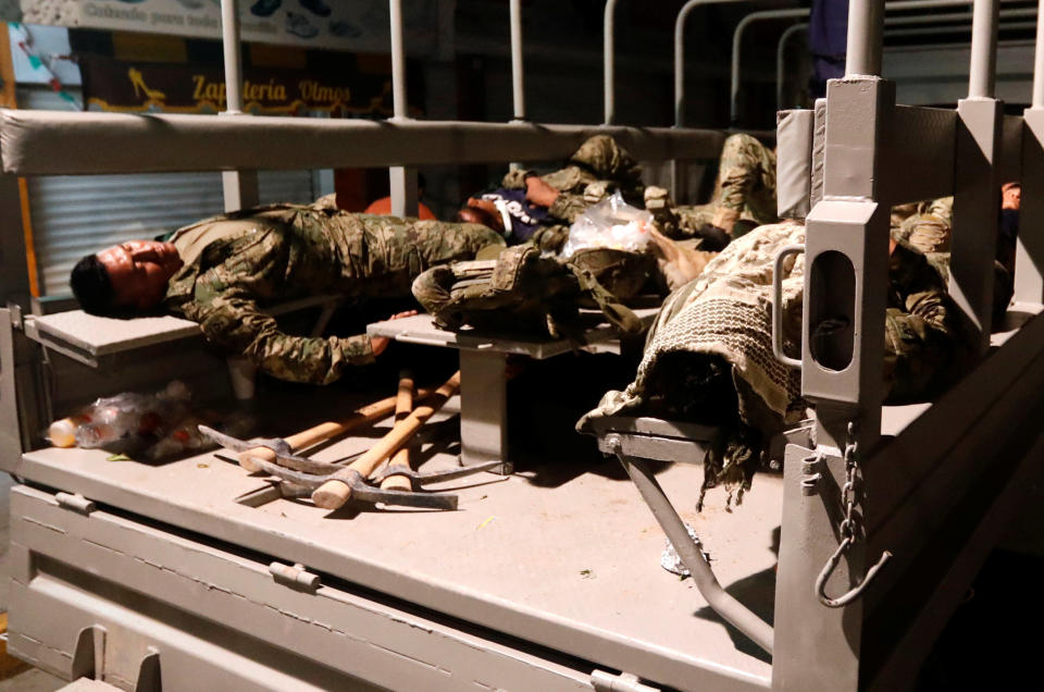 <p>Soldiers rest on a truck after rescue work in an earthquake that struck off the southern coast of Mexico late on Thursday, in Juchitan, Mexico, September 8, 2017. REUTERS/Edgard Garrido </p>