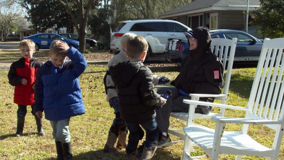 Gene McGehee gathers with the children from the day care. / Credit: CBS News