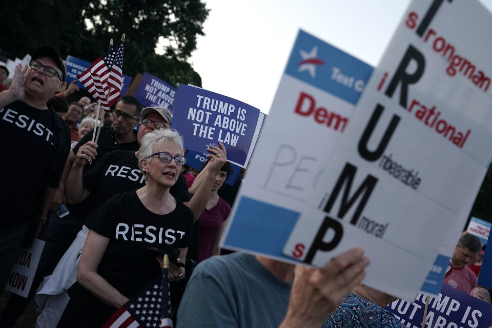 <p>Activists participate in a vigil in front of the White House on July 18, 2018, in Washington, D.C. (Photo: Alex Wong/Getty Images) </p>