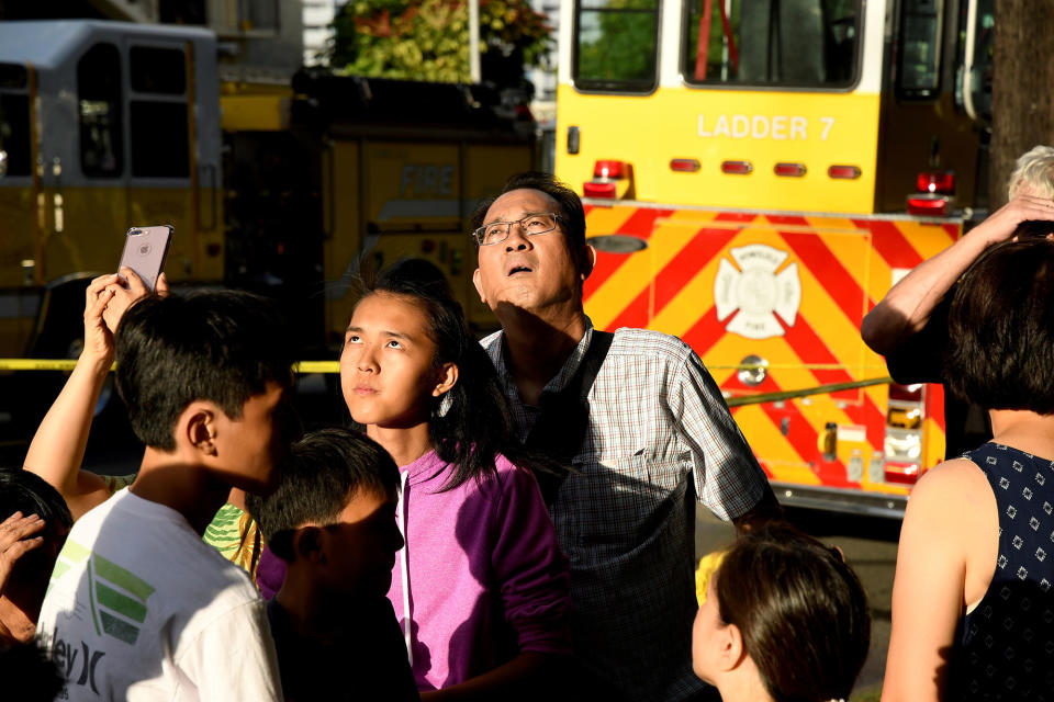 Evacuated residents look up