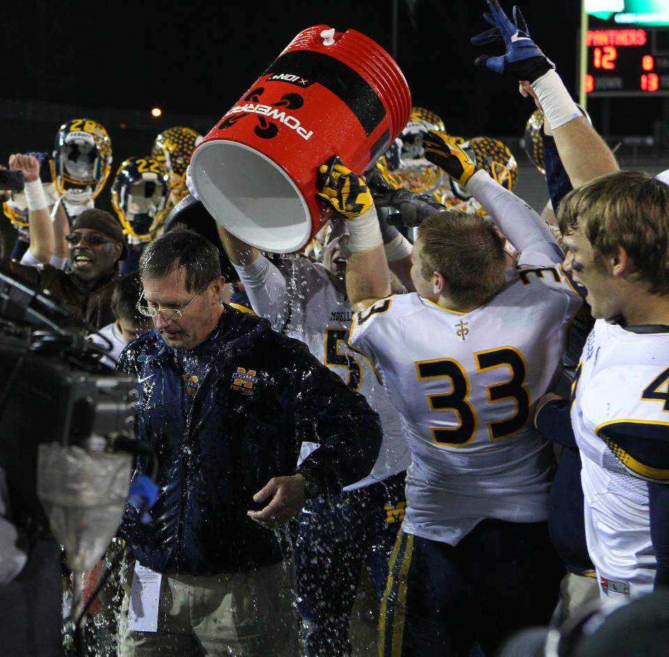 Moeller football coach John Rodenberg gets drenched in Powerade as his team celebrates beating Toledo Whitmer, 20-12, for the Division I state title on Dec. 1, 2012.