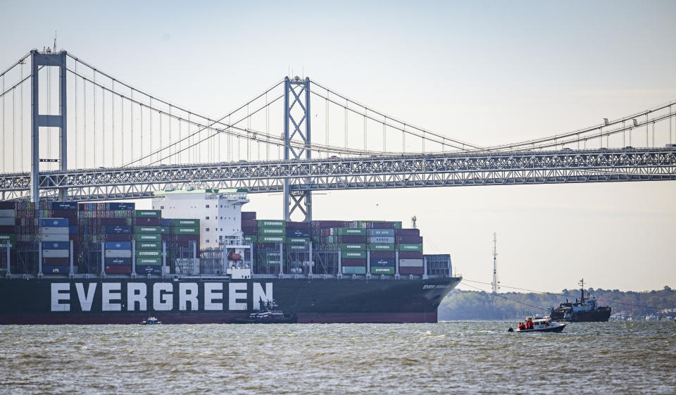 Evergreen Marine's Ever Forward container ship passes under the Chesapeake Bay Bridge after it was freed from mud outside the shipping channel off Pasadena, Md., where is had spent the past month aground. It was being taken to an anchorage south of Annapolis where the hull will be inspected for damage. (Jerry Jackson/The Baltimore Sun via AP)