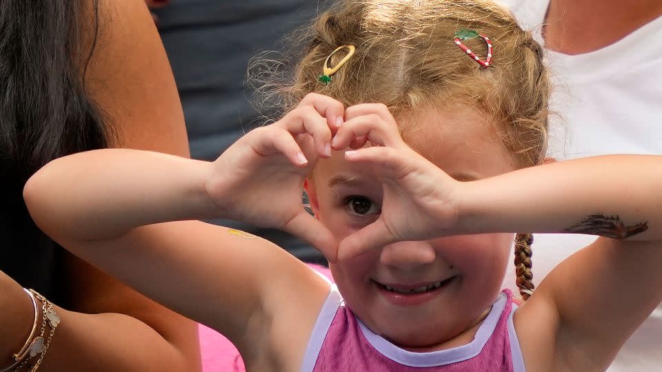 The young tennis fan motions to Sabalenka after the match. - Julia Nikhinson/AP