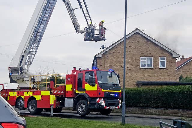 <p>Sadie Gelder / SWNS</p> The local fire department extinguishes the flames at Olivia Patterson's home