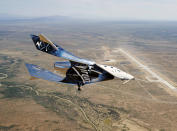 FILE - In this Friday, May 1, 2020 photo provided by Virgin Galactic, the SpaceshipTwo Unity flies free in New Mexico airspace for the first time. Founder Richard Branson is the only one of the three billionaires planning to launch himself _ from New Mexico, hopefully, by year’s end _ before putting customers aboard. (Virgin Galactic via AP)