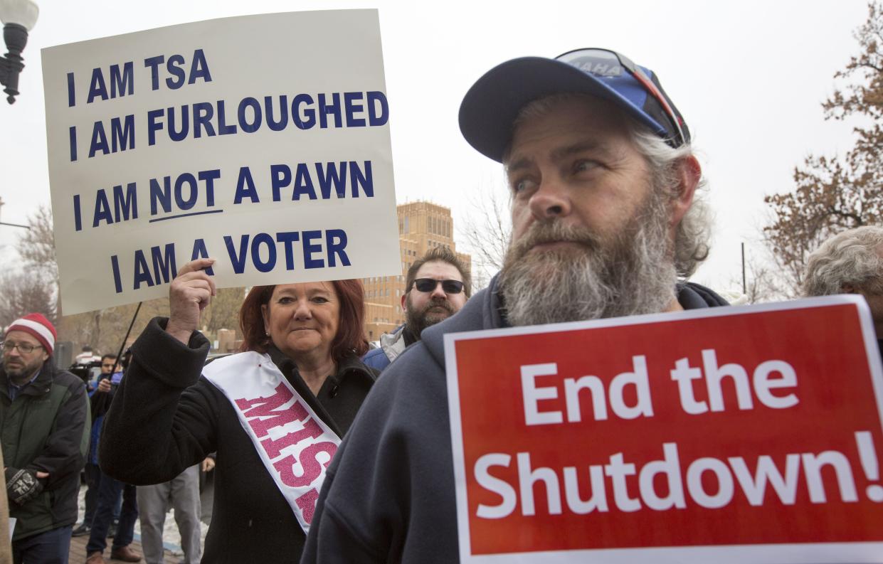 TSA employee Marae Persson (left) protesting the government shutdown at the James V. Hansen Federal Building on January 10, 2019 in Ogden, Utah.