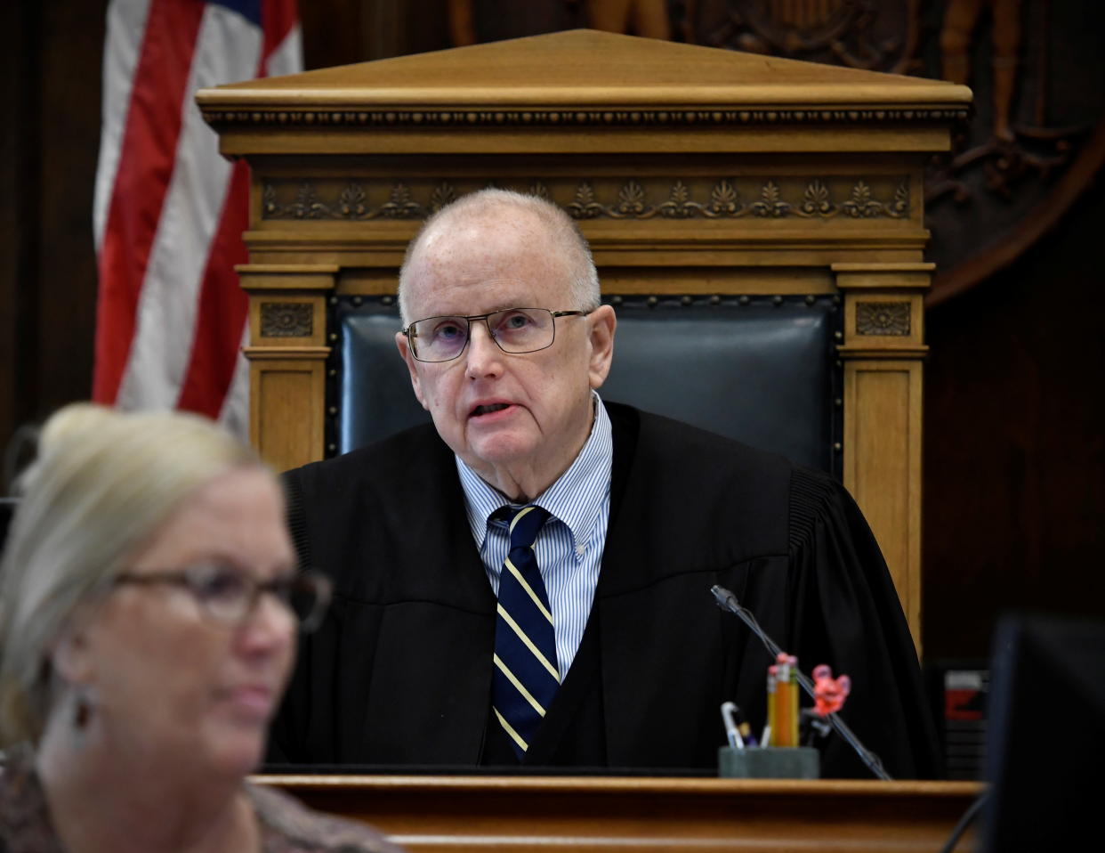 Judge Bruce Schroeder, seated, speaks during Kyle Rittenhouse's trial at the Kenosha County Courthouse in Kenosha, Wisconsin.