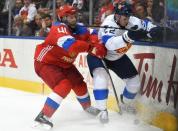 Sep 22, 2016; Toronto, Ontario, Canada; Team Russia forward Nikolay Kulemin (41) bumps Team Finland defenceman Ville Pokka (22) as they battle for the puck during preliminary round play in the 2016 World Cup of Hockey at Air Canada Centre. Mandatory Credit: Dan Hamilton-USA TODAY Sports