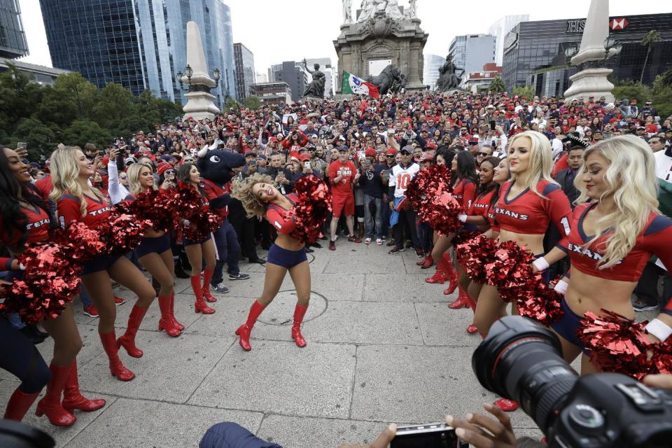<p>Houston Texans cheerleaders perform in front of the Angel of Independence monument Sunday, Nov. 20, 2016, in Mexico City. The Texans face the Oakland Raiders in an NFL football game in Mexico City Nov. 21. (AP Photo/Gregory Bull) </p>