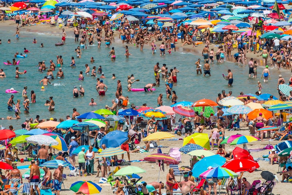 People sunbathe at Poniente Beach on July 22, 2015 in Benidorm, Spain (Getty Images)
