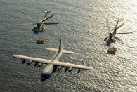 <p>Two U.S. Marine Corps CH-53E Super Stallion helicopters receive fuel from a KC-130 Hercules over the Gulf of Aden January 1, 2003. (Photo: U.S. Marine Corps/Cpl. Paula M. Fitzgerald/Handout via Reuters) </p>