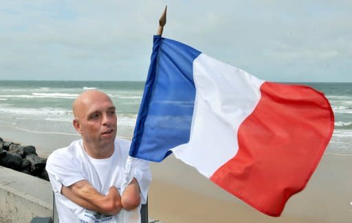 File photo of French amputee and swimmer Philippe Croizon, who has had to delay starting his swim around the world due to a paperwork problem in Papua New Guinea