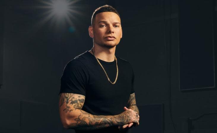 Learn here everything that is known about Kane Brown's parents. Pictured: Kane Brown posed in front of a black background. | 