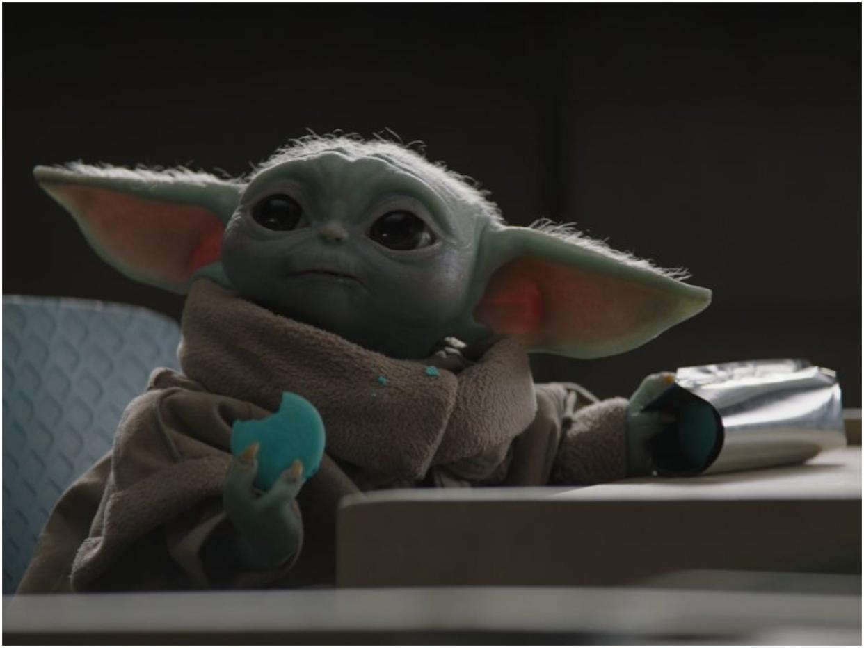 Baby Yoda eating macaron