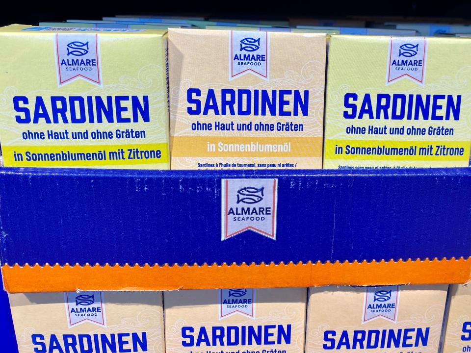 boxes of sardines on the shelves of aldi