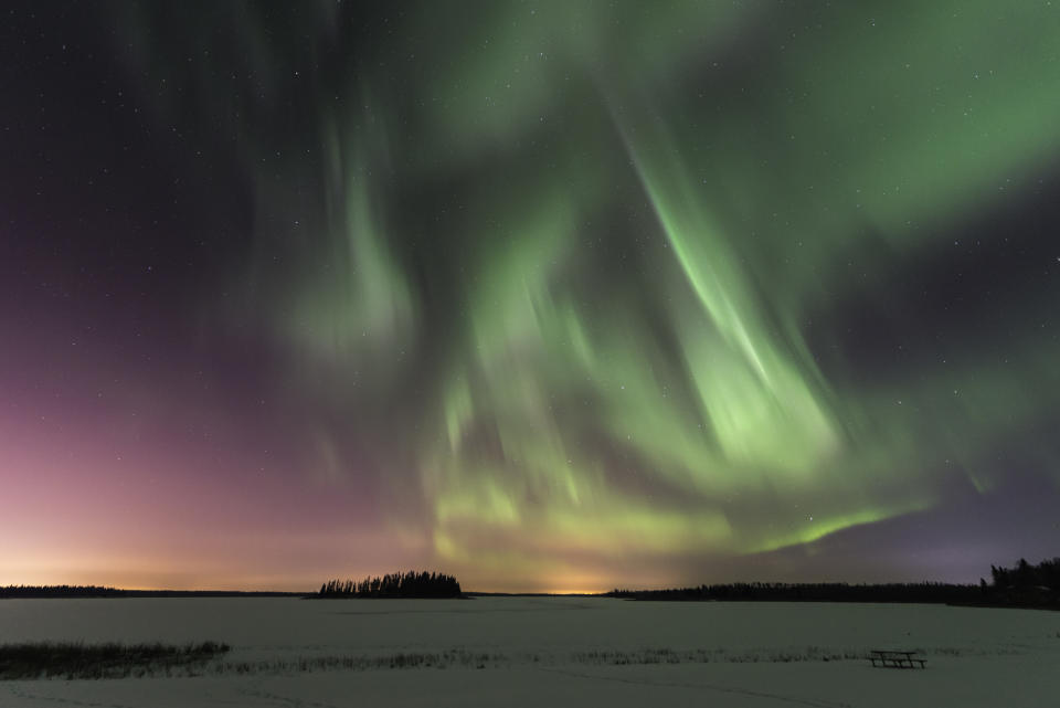 Northern Lights and terrestrial light from Edmonton 30km distant, duke it out over Astotin Lake in Elk Island National Park.aurora borealis, green, pink, curtains, pillars