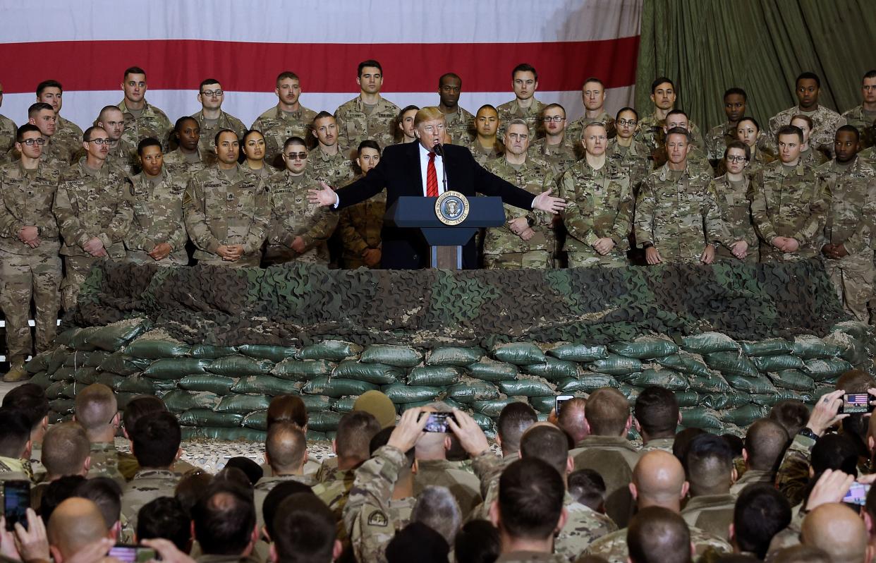 President Donald Trump speaks to the troops in 2019 during a surprise Thanksgiving day visit at Bagram Air Field in Afghanistan. 