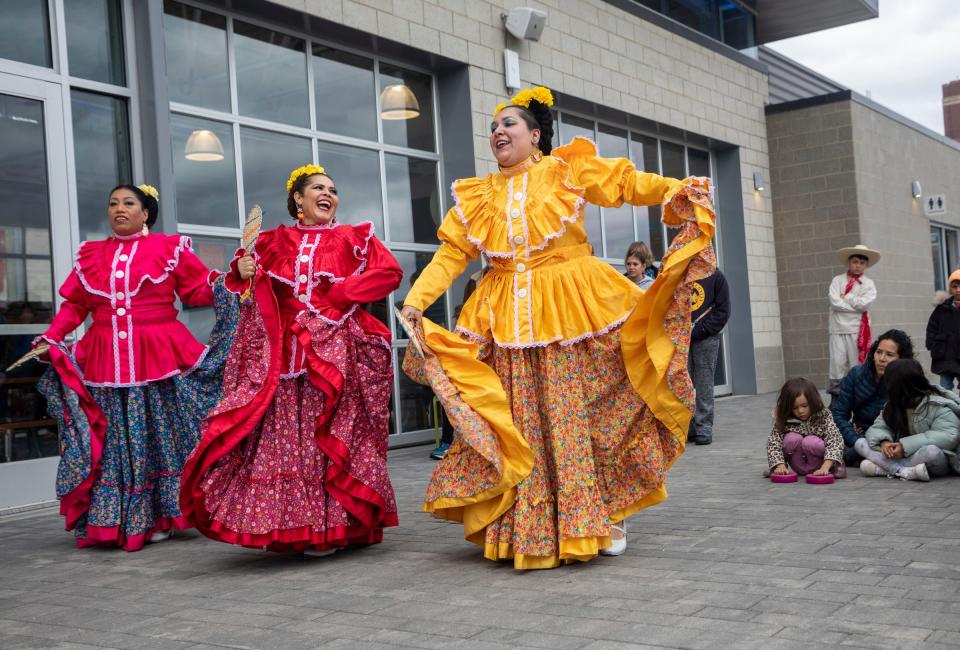 Ballet Folklorico Moyocoyani Izel members dance in front of a large crowd at a Dia de los Muertos event organized by the Detroit Riverfront Conservancy at the Robert C. Valade Park in Detroit on Saturday, Oct. 28, 2023.