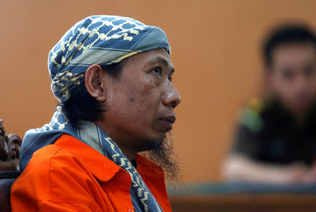 Islamic cleric Aman Abdurrahman is seen during trial in Jakarta, Indonesia February 15, 2018. REUTERS/Beawiharta