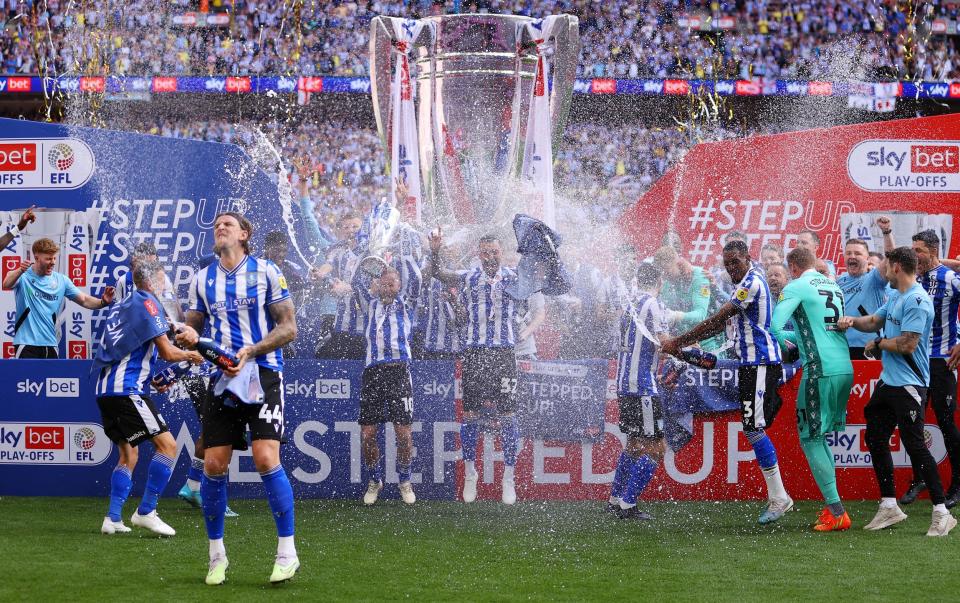 Sheffield Wednesday celebrate with the champagne - League One play-off: Dean Windass hails son Josh’s play-off winner for Sheffield Wednesday - Getty Images