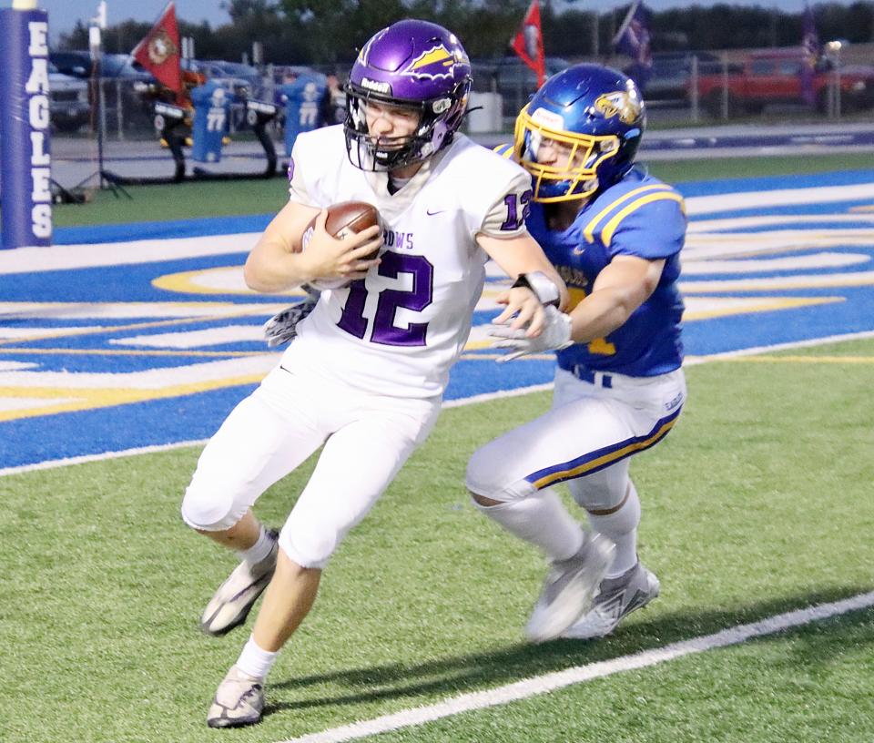 Watertown quarterback Treyton Himmerich attempts to elude an Aberdeen Central defender during an Eastern South Dakota Conference high school football game against Aberdeen Central on Friday, Sept. 29, 2023 at Aberdeen.