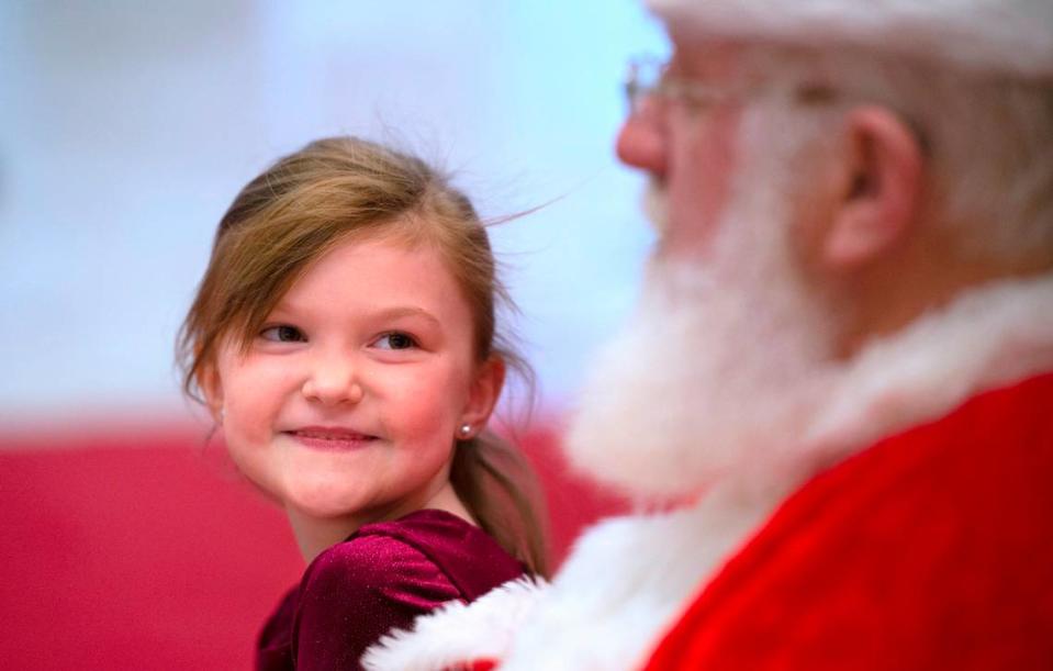 Zoey Kimball, 6, of Eatonville, talks with Santa at the South Hill Mall in Puyallup, Washington, on Wednesday, Nov. 24, 2021.