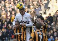 Manchester United's Chris Smalling (C) scores a goal against Hull City during their English Premier League soccer match at the KC Stadium in Hull, northern England December 26, 2013. REUTERS/Nigel Roddis