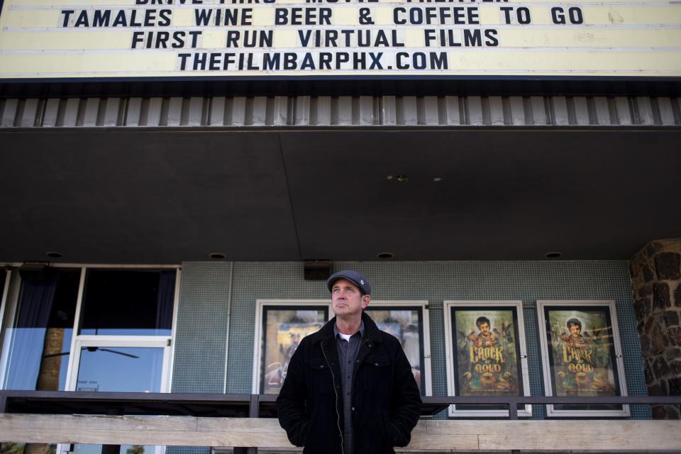 Owner Kelly Aubey stands for a portrait on Dec. 16, 2020, at FilmBar in Phoenix.