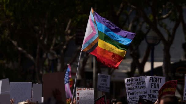 PHOTO: A Progress Pride Flag held above the crowd of LGBTQ+ activists during the Los Angeles LGBT Center's 'Drag March LA: The March on Santa Monica Boulevard', in West Hollywood, Calif., April 9, 2023. (Allison Dinner/AFP via Getty Images)