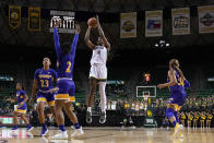 Baylor center Queen Egbo (4) shoots as Morehead State's Aiden Rainford (23), Jada Claude (2) and Terri Smith (30) defend during the second half of an NCAA college basketball game in Waco, Texas, Tuesday, Nov. 30, 2021. (AP Photo/Tony Gutierrez)