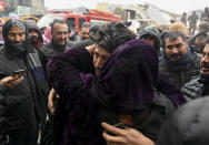 <p>HATAY, TURKIYE - FEBRUARY 06: A man hugs his mother near a collapsed Police Guesthouse building after 7.7 and 7.6 magnitude earthquakes hits Hatay, Turkiye on February 06, 2023. Disaster and Emergency Management Authority (AFAD) of Turkiye said the 7.7 magnitude quake struck at 4.17 a.m. (0117GMT) and was centered in the Pazarcik district and 7.6 magnitude quake struck in Elbistan district in the province of Kahramanmaras in the south of Turkiye. Gaziantep, Sanliurfa, Diyarbakir, Adana, Adiyaman, Malatya, Osmaniye, Hatay, and Kilis provinces are heavily affected by the earthquakes. (Photo by Ercin Erturk/Anadolu Agency via Getty Images)</p> 