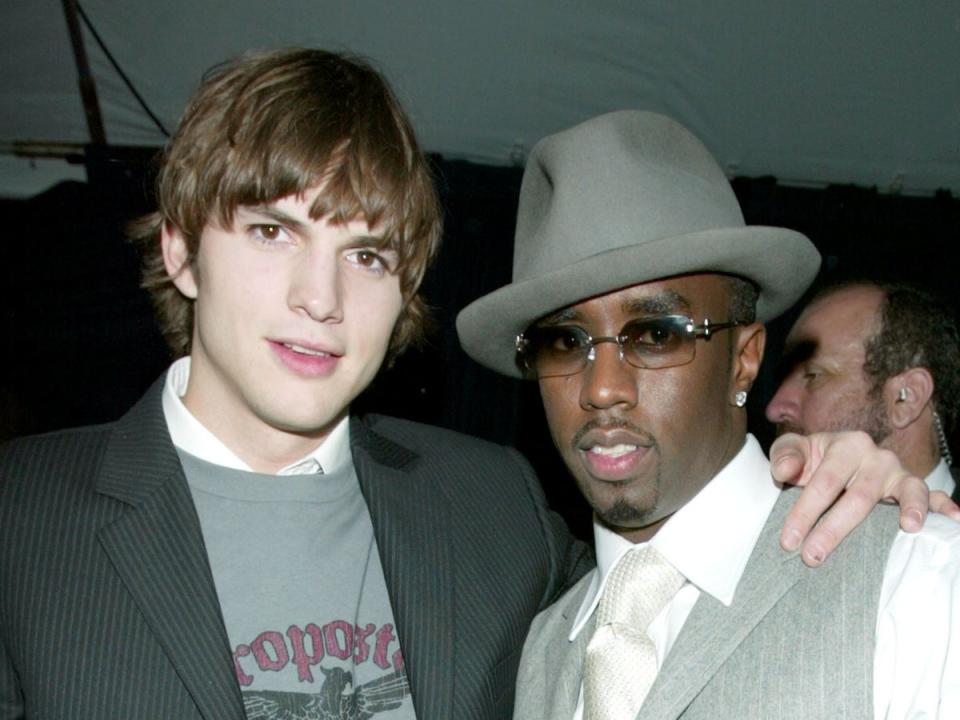 Actor Ashton Kutcher and rapper Sean “Diddy” Combs in 2003 (Getty Images)