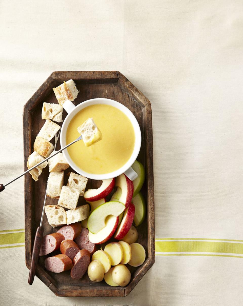 <p>This boozy spread makes a great appetizer for any party. And there are tons more ways you can <a href="https://www.goodhousekeeping.com/holidays/more-holidays/recipes-with-beer" rel="nofollow noopener" target="_blank" data-ylk="slk:cook with your Irish stout;elm:context_link;itc:0;sec:content-canvas" class="link ">cook with your Irish stout</a>, if you want to start a theme.</p><p><a class="link " href="https://www.amazon.com/Prepworks-Progressive-Ceramic-Included-Dishwasher/dp/B00004RDF3?tag=syn-yahoo-20&ascsubtag=%5Bartid%7C10055.g.981%5Bsrc%7Cyahoo-us" rel="nofollow noopener" target="_blank" data-ylk="slk:SHOP FONDUE SETS;elm:context_link;itc:0;sec:content-canvas">SHOP FONDUE SETS</a></p><p><a href="https://www.goodhousekeeping.com/recipefinder/cheddar-beer-fondue-recipe-ghk0213" rel="nofollow noopener" target="_blank" data-ylk="slk:Get the recipe for Cheddar-Beer Fondue »;elm:context_link;itc:0;sec:content-canvas" class="link "><em>Get the recipe for Cheddar-Beer Fondue »</em></a></p>