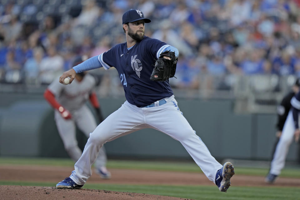 Kansas City Royals starting pitcher Jordan Lyles throws during the first inning of a baseball game against the against the Washington Nationals Friday, May 26, 2023, in Kansas City, Mo. (AP Photo/Charlie Riedel)