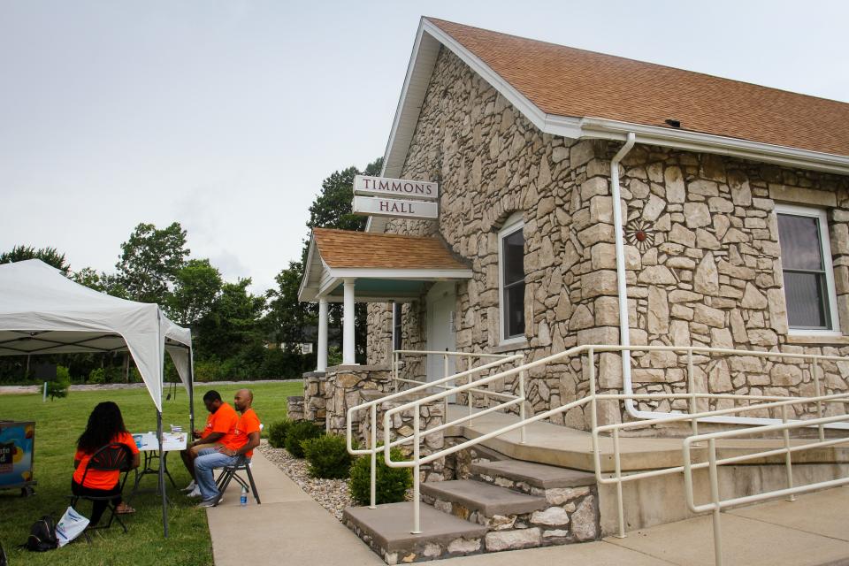 Volunteers wait outside Timmons Hall Sunday, June 27, 2021.