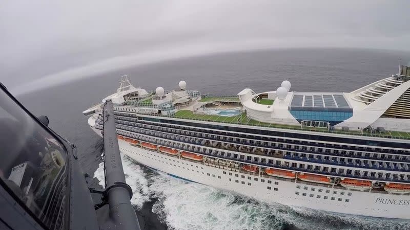 Airmen from the Moffett Federal Airfield based, 129th Rescue Wing deliver coronavirus test-kits to the Grand Princess cruise ship off the coast of California