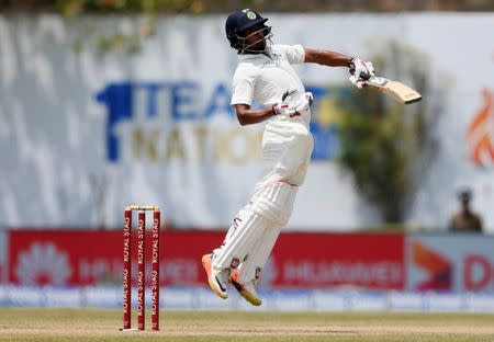 Cricket - Sri Lanka v India - First Test Match - Galle, Sri Lanka - July 27, 2017 - India's cricketer Wriddhiman Saha reacts for a bouncer ball by Sri Lanka's Lahiru Kumara (not pictured). REUTERS/Dinuka Liyanawatte