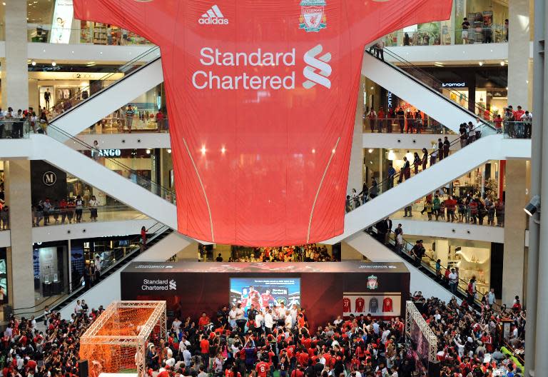 In this file photo, a gaint Liverpool FC shirt is seen hanging at a shopping mall during a promotion event as the players sign autographs to Malaysian fans, in Kuala Lumpur, on July 15, 2011