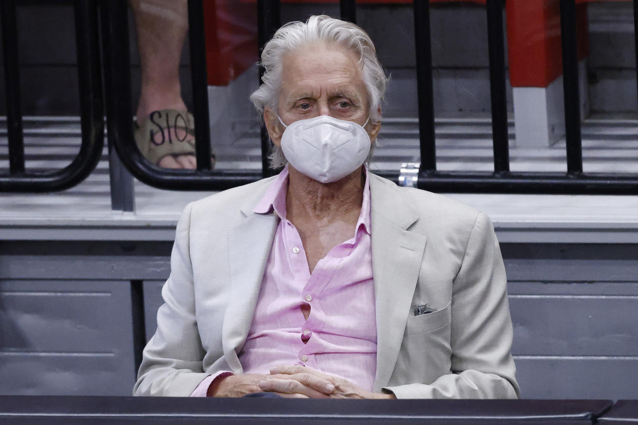 MIAMI, FLORIDA - APRIL 24: Actor Michael Douglas watches play between the Miami Heat and the Chicago Bulls during the fourth quarter at American Airlines Arena on April 24, 2021 in Miami, Florida. NOTE TO USER: User expressly acknowledges and agrees that, by downloading and or using this photograph, User is consenting to the terms and conditions of the Getty Images License Agreement. ( (Photo by Michael Reaves/Getty Images)