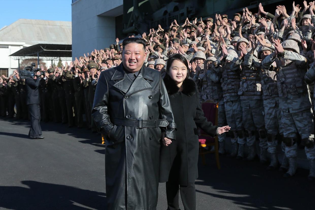 An undated photo released by the official North Korean Central News Agency (KCNA) on 27 November 2022 shows North Korean leader Kim Jong-un (C-L) walking with his daughter, presumed to be his second child, Ju-ae (C-R), during a photo session with the contributors to the successful test-fire of new-type ICBM Hwasongpho-17 at an undisclosed location in North Korea. Successful test launch of Hwasongpho-17, Pyongyang, North Korea - 27 Nov 2022