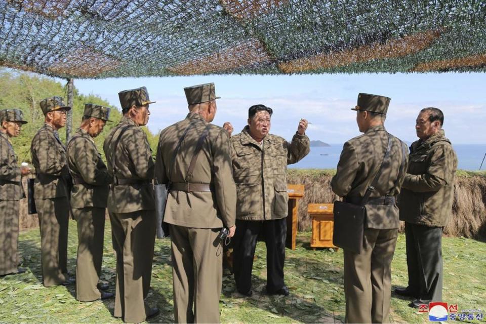 Kim Jong Un inspects military exercises at an undisclosed location (KCNA/AP)