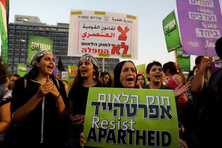 Israeli Arabs and their supporters take part in a rally to protest against Jewish nation-state law in Rabin square in Tel Aviv, Israel August 11, 2018. REUTERS/Ammar Awad
