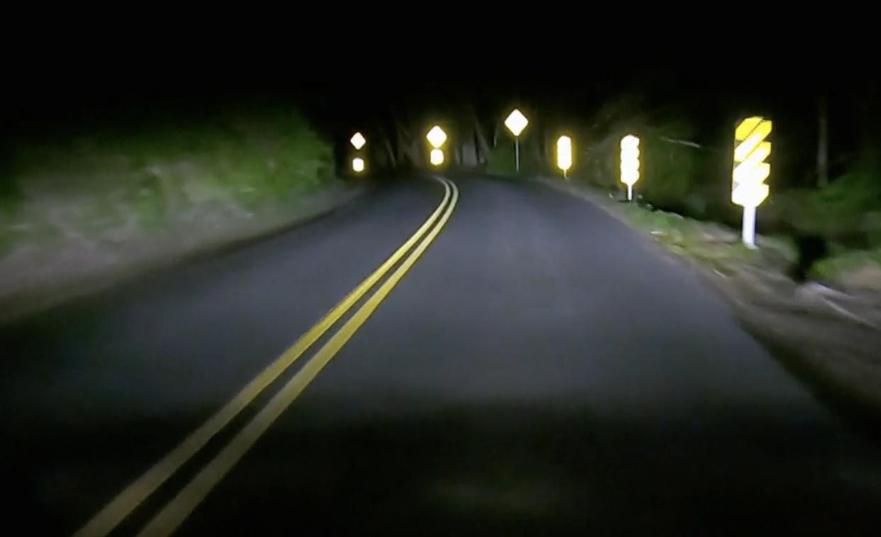 Streets signs reflect light from a car. (NBC News)